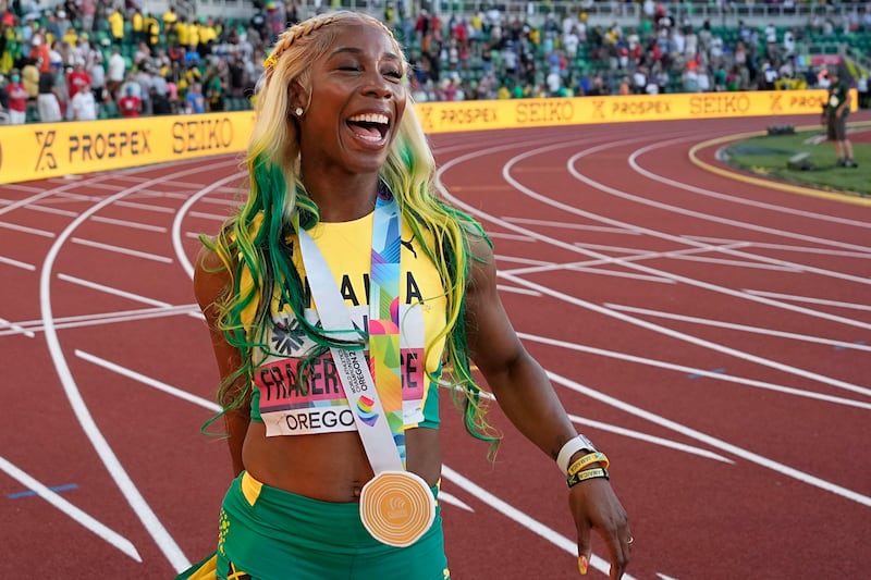 Shelly-Ann Fraser-Pryce after winning gold in the final of the women's 100-metres at the World Athletics Championships. AP
