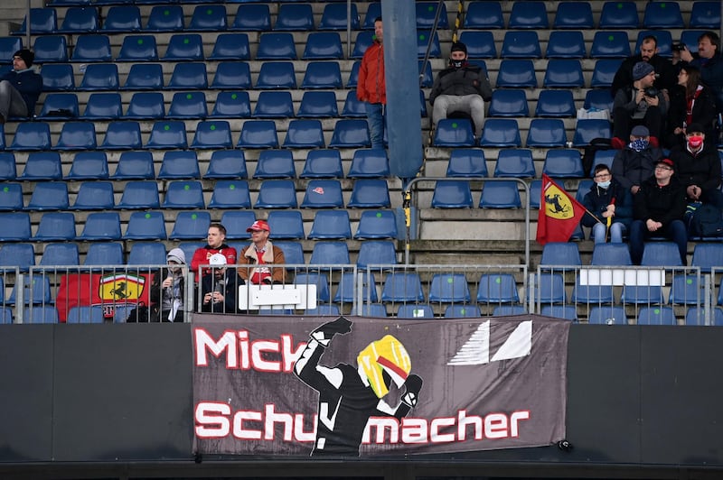 A banner in the stands supporting German driver Mick Schumacher, who was scheduled to drive for Alfa Romeo in the first practice session for the Eifel GP. AP