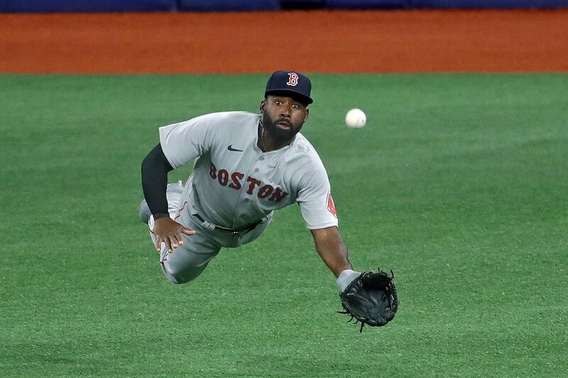 Boston Red Sox center fielder Jackie Bradley Jr. makes a diving catch against the Tampa Bay Rays in Florida on Tuesday, August 4. AP