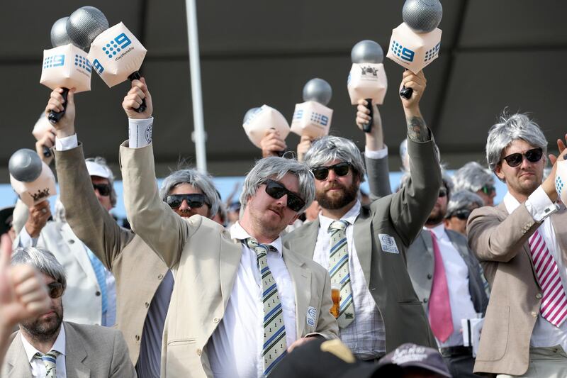 epa06390910 Fans dressed as Australian cricketer and commentator Richie Benaud sing on Day Two of the Third Test match between Australia and England at the WACA in Perth, Western Australia, Australia, 15 December 2017.  EPA/RICHARD WAINWRIGHT -- EDITORIAL USE ONLY, IMAGES TO BE USED FOR NEWS REPORTING PURPOSES ONLY, NO COMMERCIAL USE WHATSOEVER, NO USE IN BOOKS WITHOUT PRIOR WRITTEN CONSENT FROM AAP -- AUSTRALIA AND NEW ZEALAND OUT