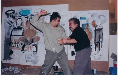 A photo provided by Mahmoud Al Obaidi that shows the artist with Ismail Fattah capturing a fun moment between the two. Taken in 2001 in Doha. Courtesy Mahmoud Al Obaidi