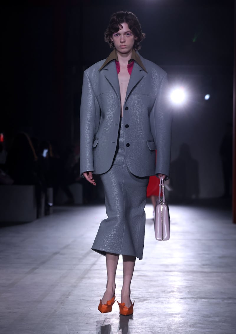 A sculpted jacket and skirt in uniform grey at Prada. EPA 