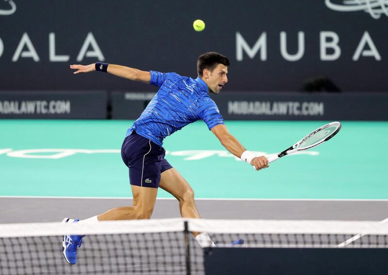 Abu Dhabi, United Arab Emirates - Reporter: Jon Turner: Novak Djokovic plays a shot during the third place play-off between Novak Djokovic v Karen Khachanov at the Mubadala World Tennis Championship. Saturday, December 21st, 2019. Zayed Sports City, Abu Dhabi. Chris Whiteoak / The National