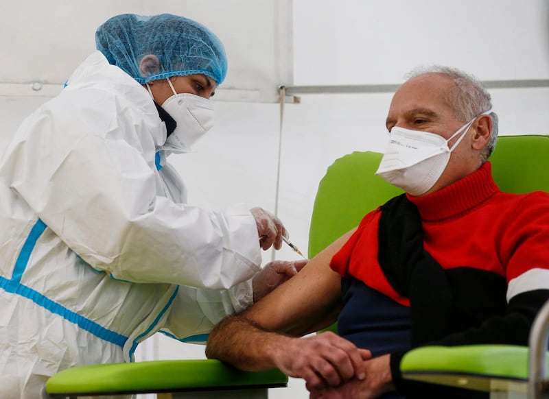 A nurse administers the COVID-19 vaccine to a healthcare worker at Santa Maria Della Pieta hospital in Rome. 80 healthcare workers received Covid-19 vaccinations on Monday in a Rome hospital. They are part of the campaign that started across Italy to vaccinate all healthcare workers first. AP Photo