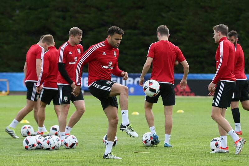 Wales' Hal Robson-Kanu, foreground, plays with the ball during a training session in Dinard, France, Monday, July 4, 2016. Wales will face Portugal in a Euro 2016 semifinal match at the Grand Stade in Decines-Charpieu, near Lyon, France, Wednesday, July 6, 2016. (AP Photo/Vincent Michel)