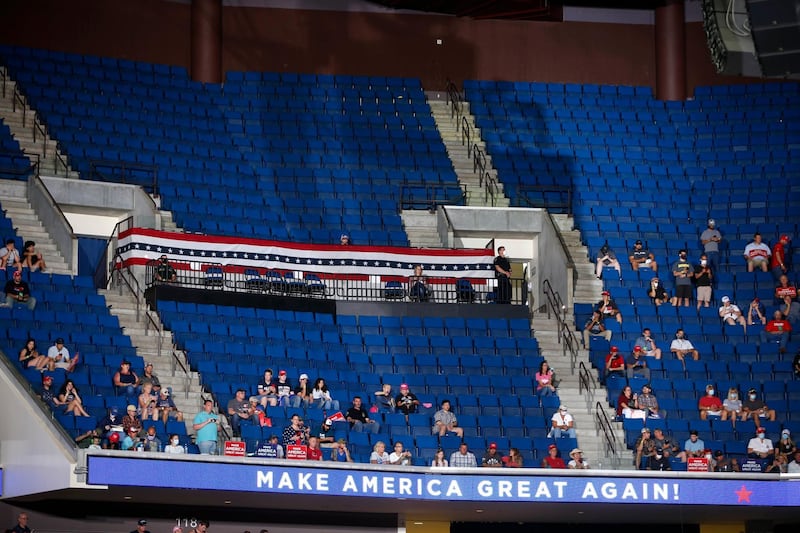 Empty seats are visible in the upper level at a campaign rally for US President Donald Trump at BOK Centre. Tulsa World via AP
