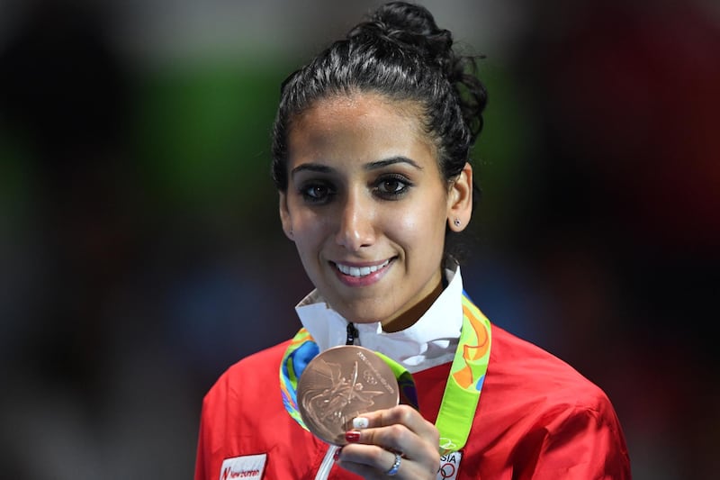 Tunisia's bronze medallist Ines Boubakri poses on the podium during the medal ceremony for the women's individual foil fencing event of the Rio 2016 Olympic Games at the Carioca Arena 3 in Rio de Janeiro on August 10, 2016. (Photo by Kirill KUDRYAVTSEV / AFP)