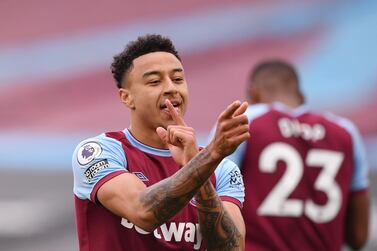 West Ham's Jesse Lingard, right, celebrates after scoring his side's opening goal during the English Premier League soccer match between West Ham United and Arsenal at the London Stadium in London, England, Sunday, March 21, 2021. (Justin Tallis, Pool via AP)