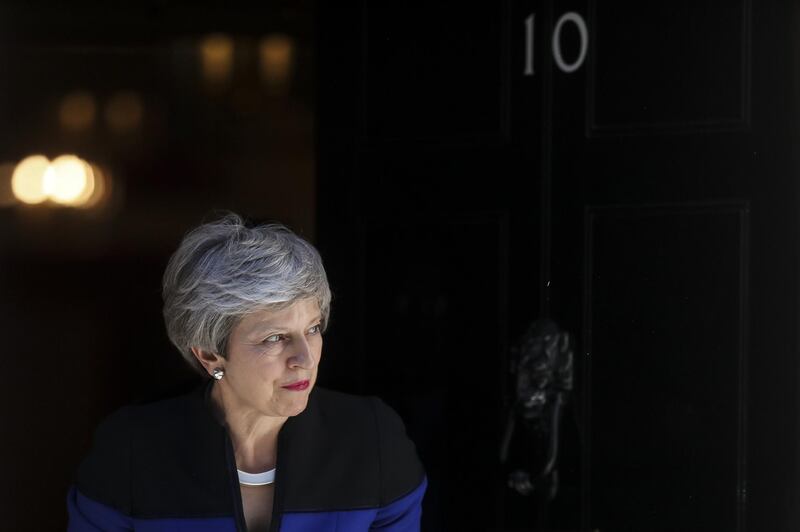 Theresa May, U.K. prime minister, waits to greet Jens Stoltenberg, secretary general of the North Atlantic Treaty Organization (NATO), ahead of a bilateral meeting inside number 10 Downing Street in London, U.K., on Tuesday, May 14, 2019. May is preparing to put her Brexit deal back to Parliament as she seeks to revive stalled talks with opposition Labour Party leader Jeremy Corbyn on a joint plan for the divorce. Photographer: Simon Dawson/Bloomberg