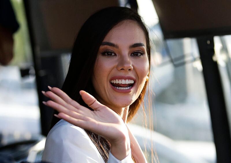 Catriona Gray waves as she arrives for a visit in Manila. AP Photo