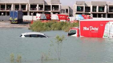 Vehicles submerged in water in Al Qudra, Dubai, after heavy rain deluged the city on Tuesday. Chris Whiteoak / The National