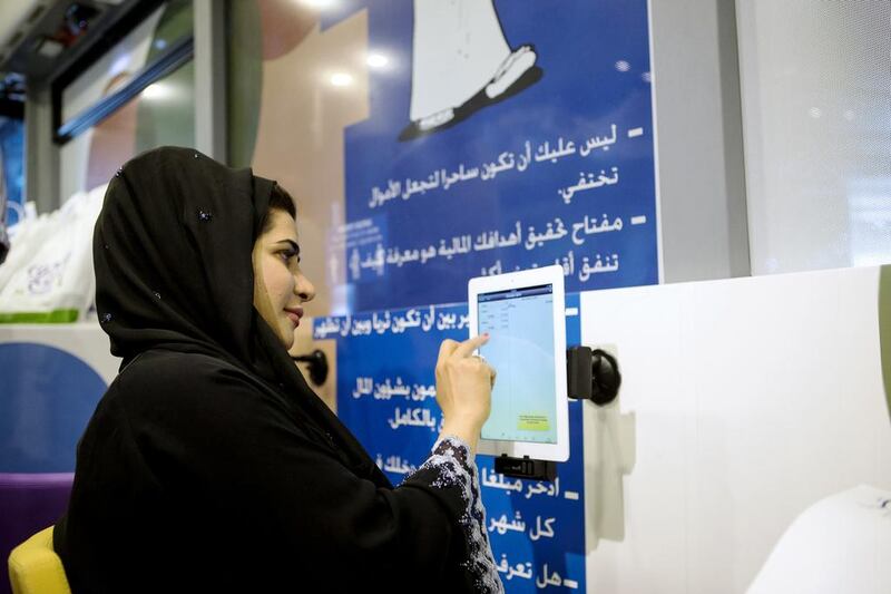 The financial literacy bus, sponsored by the Emirates Foundation for Youth Development, aims to educate young people on how to manage money and avoid debt, at Jumeirah at Etihad Towers in Abu Dhabi. Christopher Pike / The National