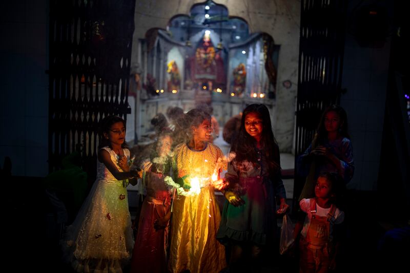 Children play with firecrackers. AP Photo