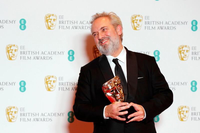 TOPSHOT - British director Sam Mendes poses with the award for a Director for his work on the film '1917' at the BAFTA British Academy Film Awards at the Royal Albert Hall in London on February 2, 2020.
  / AFP / Adrian DENNIS
