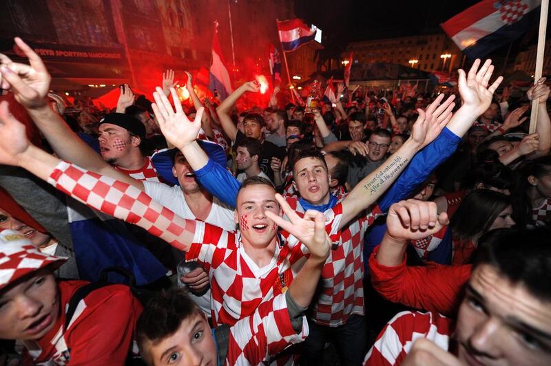 Croatian football fans react as they watch the opening match of the 2014 Fifa World Cup, a group A football match between Croatia and Brazil, on June 12, 2014, in the Croatian capital Zagreb’s main square. Several thousands of people gathered at Zagreb’s main square to watch the match between Croatia and Brazil on a giant screen. AFP PHOTO / STRINGER