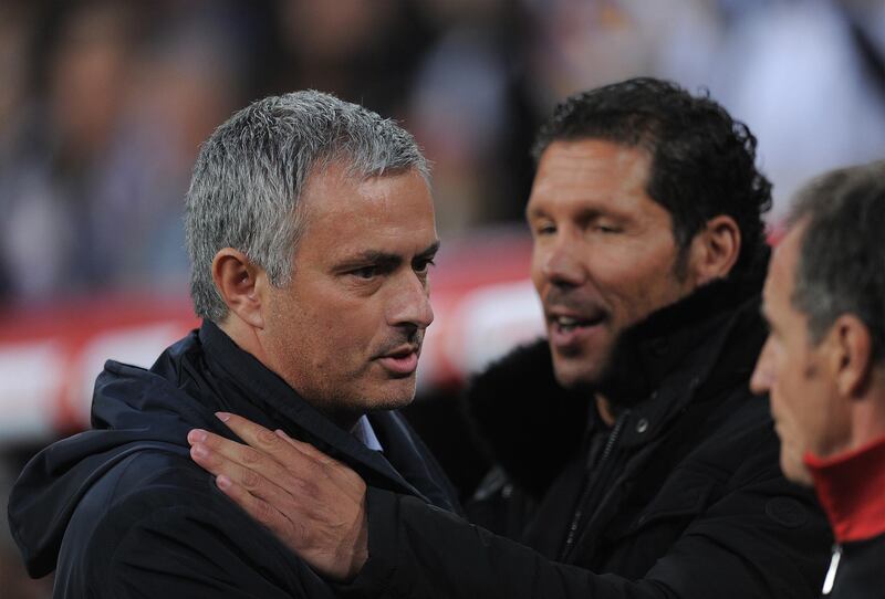 MADRID, SPAIN - MAY 17:  Head coach Jose Mourinho (L) of Real Madrid greets Head coach Diego Simeone of Atletico de Madrid before the start of the Copa del Rey Final between Real Madrid CF and Club Atletico de Madrid at Estadio Santiago Bernabeu on May 17, 2013 in Madrid, Spain.  (Photo by Denis Doyle/Getty Images)