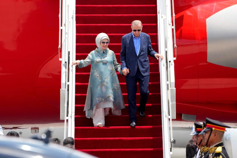 Turkey's President Recep Tayyip Erdogan and his wife Emine Erdogan arrive to attend the meeting. AFP