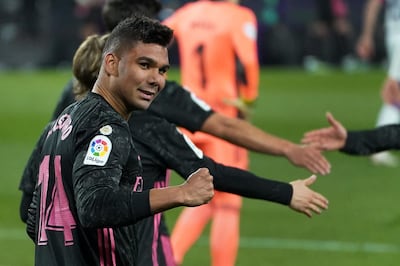 Real Madrid's Brazilian midfielder Casemiro celebrates after scoringduring the Spanish league football match between Real Valladolid FC and Real Madrid CF at the Jose Zorilla stadium in Valladolid on February 20, 2021. / AFP / Cesar Manso
