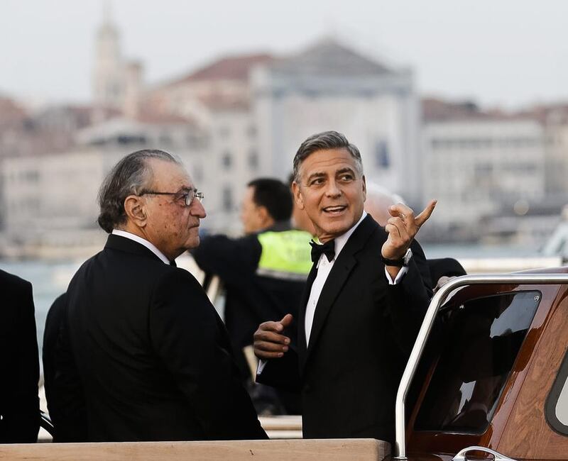 George Clooney talks to Ramzi Alamuddin, Amal's father, ahead of his wedding in Venice. AP 
