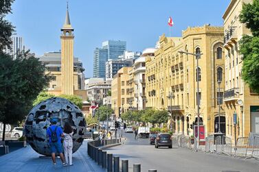 epa07860687 People look at the artwork for the Lebanese sculptor Bassam Kyrillos 'Equinox' made by aluminum and synthetic colors diameter 300 cm during a Beirut Art Week 2019 in downtown Beirut, Lebanon, 22 September 2019. The Beirut Art Week runs from 17 to 24 September​. EPA/WAEL HAMZEH