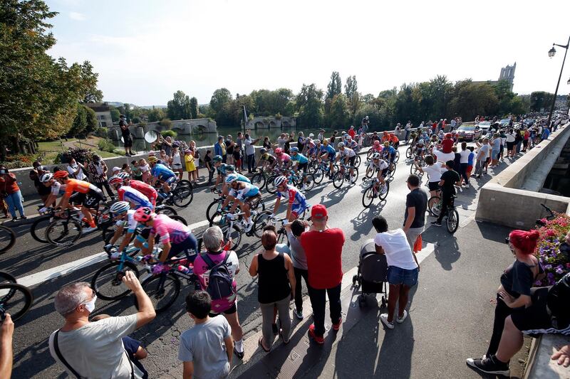 Spectators watch the peloton passing by during the 21st stage of the Tour de France cycling race over 122 km from Mantes la Jolie to Paris, France.  EPA