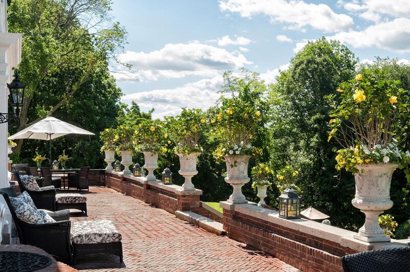 The formal patio overloooking the pool at the 5.4-acre Northway estate in Lattingtown, Nassau County, New York