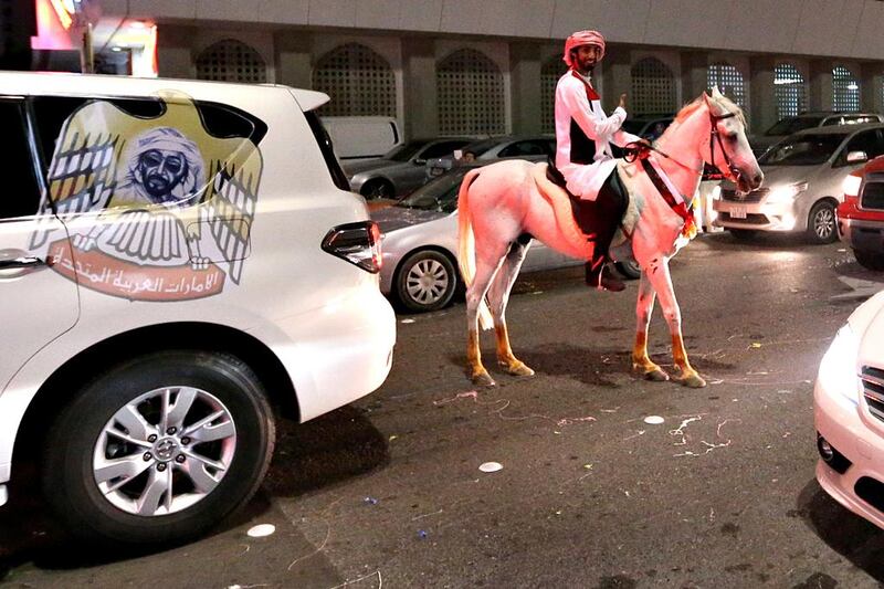 Revellers came by car, foot... and horse. Fatima Al Marzooqi / The National 