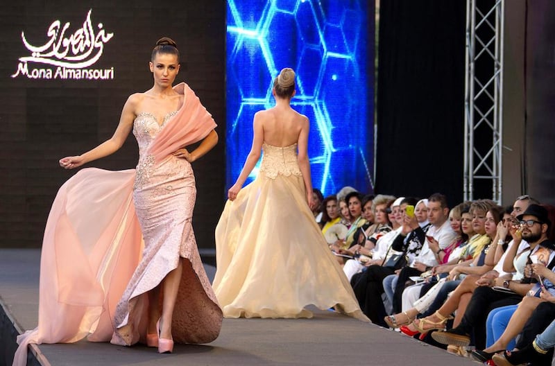 Models present creations from the summer collection of UAE designer Mona Al Mansouri during the Summer Fashion Week at the Saint Georges Hotel in Beirut. Nabil Mounzer / EPA