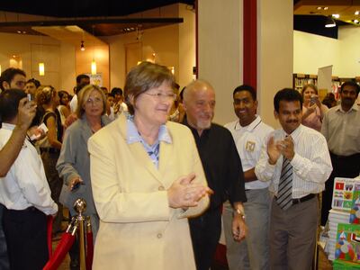 Isobel Abulhoul, front, and Paulo Coelho, on her left, at Magrudy's, Ibn Battuta Mall in 2005. Photo: Magrudy's