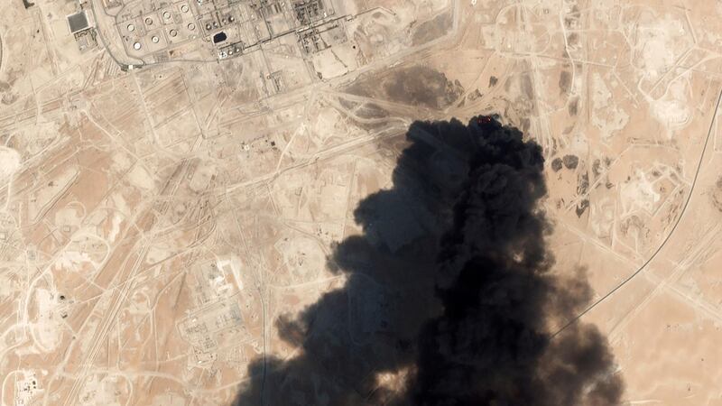 A satellite image from Planet Labs Inc., shows thick black smoke rising from Saudi Aramco's Abqaiq oil processing facility in Buqyaq, Saudi Arabia.The weekend drone attack on one of the world’s largest crude oil processing plants that dramatically cut into global oil supplies is the most visible sign yet of how Aramco’s stability and security is directly linked to that of its owner -- the Saudi government and its ruling family. AP