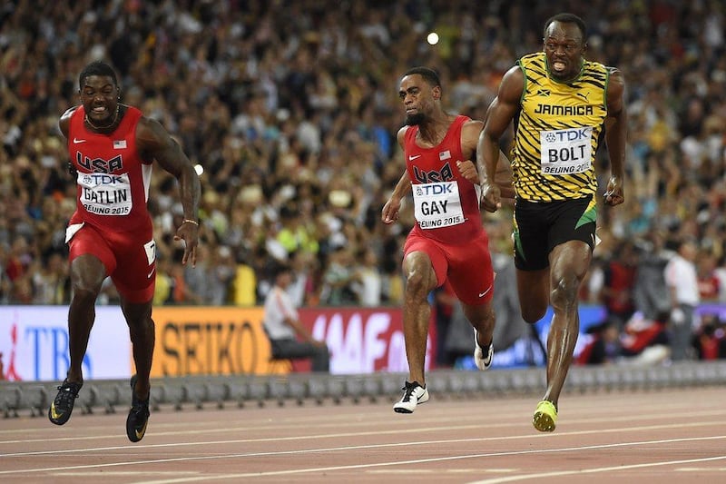 Usain Bolt crosses the finish line just ahead of Justin Gatlin to win the 100-metres world title on Sunday in Beijing. Olivier Morin / AFP / August 23, 2015