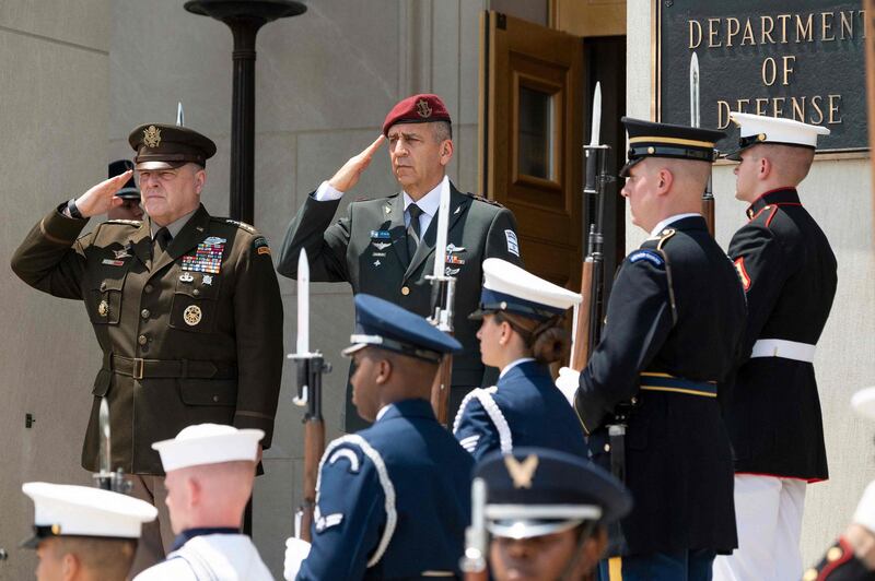 Chairman of the Joint Chiefs of Staff Army General Mark Milley (L) hosts an enhanced honor cordon for the Israeli Chief of Defense LTG Aviv Kohavi at the Pentagon in Washington, DC, on June 21, 2021. / AFP / JIM WATSON
