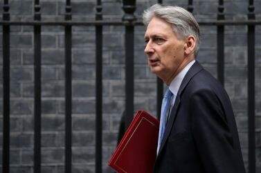 Britain's Chancellor of the Exchequer Philip Hammond has been looking to woo the DUP and ERG to back Theresa May's Brexit deal. AFP
