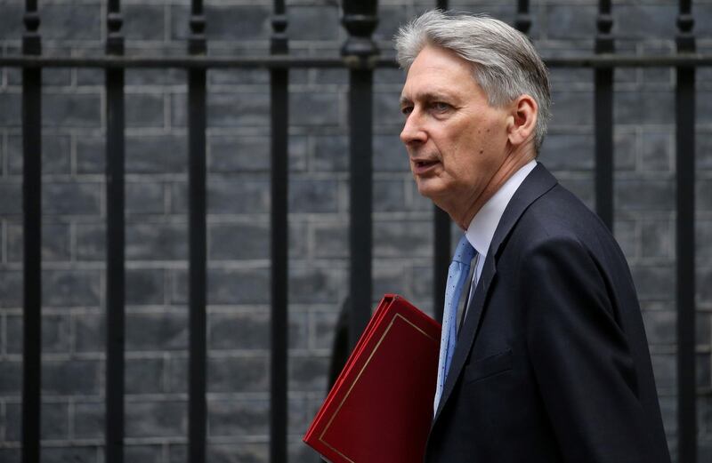 Britain's Chancellor of the Exchequer Philip Hammond arrives in Downing Street in London on March 14, 2019, ahead of a further Brexit vote. British MPs will vote today on whether to ask the European Union for an extension to the March 29 Brexit deadline, with the whole process mired in chaos.
 / AFP / ISABEL INFANTES
