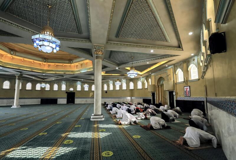 Abu Dhabi, United Arab Emirates, August 3, 2020.   Worshippers at the Bani Hashim Mosque at the Al Maqta area during the first day restrictions have been eased on Mosque's in Abu Dhabi to allow 50% occupancy.Victor Besa /The NationalSection: NAReporter: