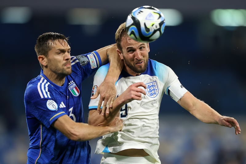 England captain Harry Kane battles for possession with Rafael Toloi of Italy during the Euro 2024 qualifier at Stadio Diego Armando Maradona on March 23, 2023. Getty