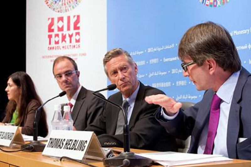 This handout photo taken and released by the IMF on October 9, 2012 shows the International Monetary Fund (IMF) economic counsellor and director of research department, Olivier Blanchard (2nd R) , IMF Deputy Director Jorg Decressin (2nd L), IMF Division Chief Thomas Heibling (R) and IMF Senior Press Officer Gita Bhatt (L) holding a press briefing on the World Economic Outlook (WEO) at the Tokyo International Forum in Tokyo.  The IMF on October 9 cut its growth forecasts for developing Asia, blaming a slowdown in Europe and the United States, and warned that China's attempts to boost its economy had not taken hold.       AFP PHOTO / IMF / Stephen Jaffe                    -----EDITORS NOTE---- RESTRICTED TO EDITORIAL USE - MANDATORY CREDIT "AFP PHOTO / IMF / Stephen Jaffe" - NO MARKETING NO ADVERTISING CAMPAIGNS - DISTRIBUTED AS A SERVICE TO CLIENTS

 *** Local Caption ***  633791-01-08.jpg