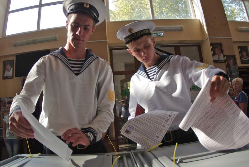 Cadets of the Nakhimov naval academy vote at a polling station during Russia's parliamentary elections in Sevastopol, Crimea. AFP