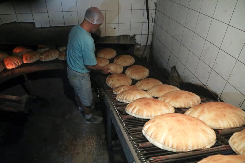 A baker produces fresh bread in Beirut, Lebanon on March 8, 2022.  Reuters