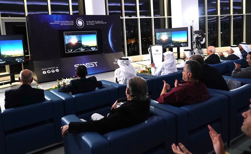 Emirati engineers watch the satellite's launch