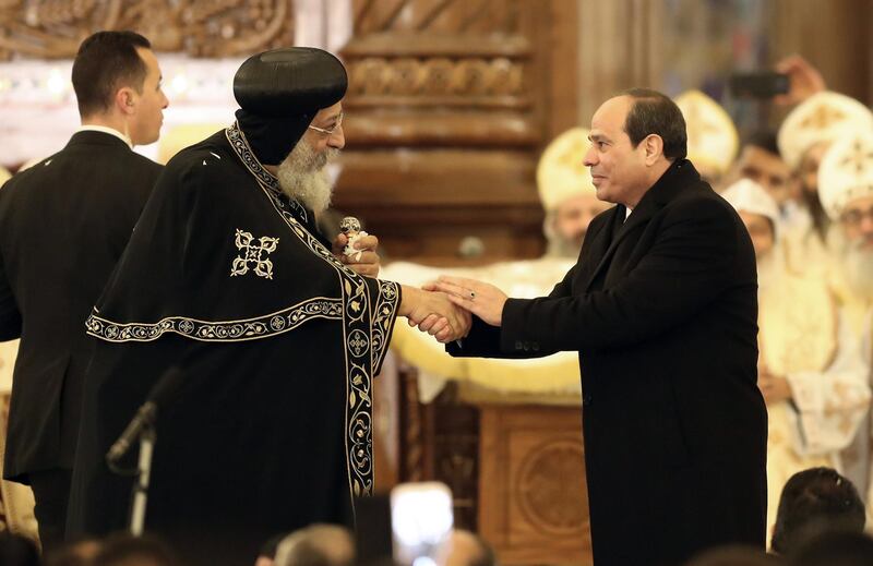epa07266074 Pope Tawadros II of Alexandria (L) listens as Egyptian President Abdel Fattah al-Sisi (R) speaks before mass at the newly inaugurated Cathedral of Nativity in the New Administrative Capital, Egypt, 06 January 2019. The Middle East's biggest cathedral is inaugurated by Eygpt's President  a day after a deadly bomb blast near a church. Orthodox believers celebrate Christmas Day on 07 January, according to the Julian calendar.  EPA/KHALED ELFIQI