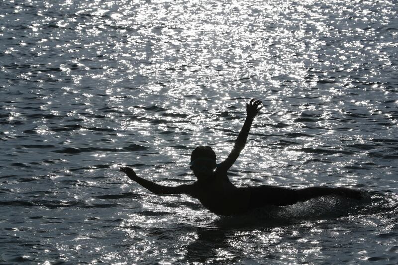 A boy swims at the beach in Budaiya, Bahrain. Reuters