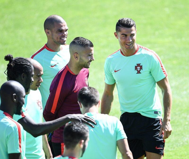 Portugal's Pepe, centre left, and Cristiano Ronaldo, centre right, with teammates during a training session in Marcoussis near Paris, France, 09 July 2016. Portugal face France on 10 July in the Euro 2016 final. EPA/FILIP SINGER