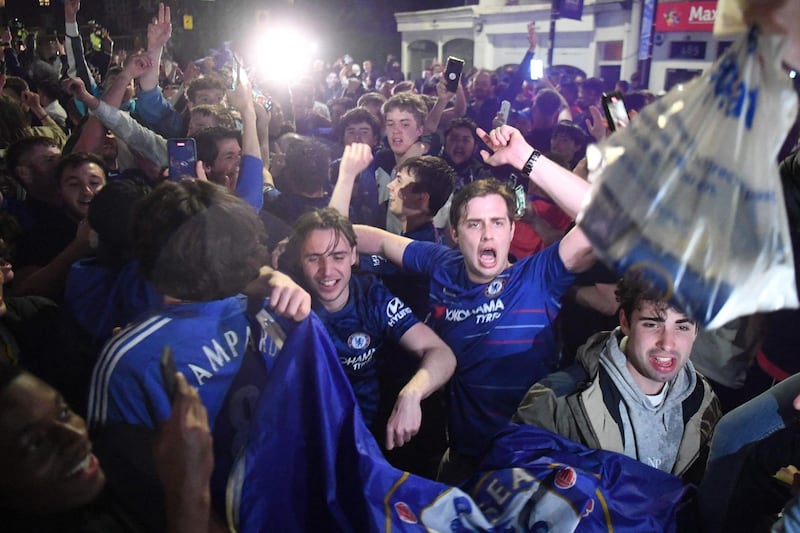 Chelsea supporters celebrate in streets surrounding their Stamford Bridge stadium in London their Champions League victory. AFP