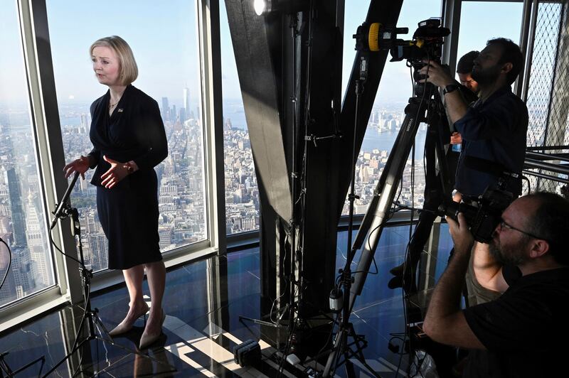 Ms Truss speaks to the media during her visit to the Empire State building in New York. AP