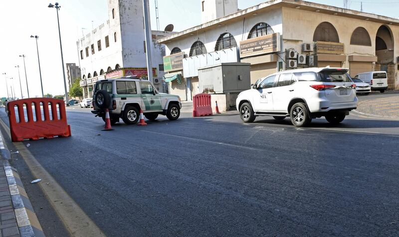 Saudi police close a street leading to a non-Muslim cemetery in the Saudi city of Jeddah where a bomb struck a World War I commemoration attended by European diplomats on November 11, 2020 leaving several people wounded amid Muslim anger over French cartoons.

 The attack is the second assault in the kingdom in less than a month, as French President Emmanuel Macron has sought to assuage anger across Muslim nations over satirical cartoons of the Prophet Mohammed.
 / AFP / -
