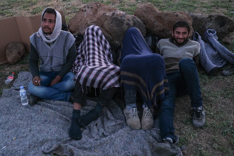 A group of Afghan and Iranian refugees rest next to the railway in Tatvan district in Bitlis city eastern province of Turkey.