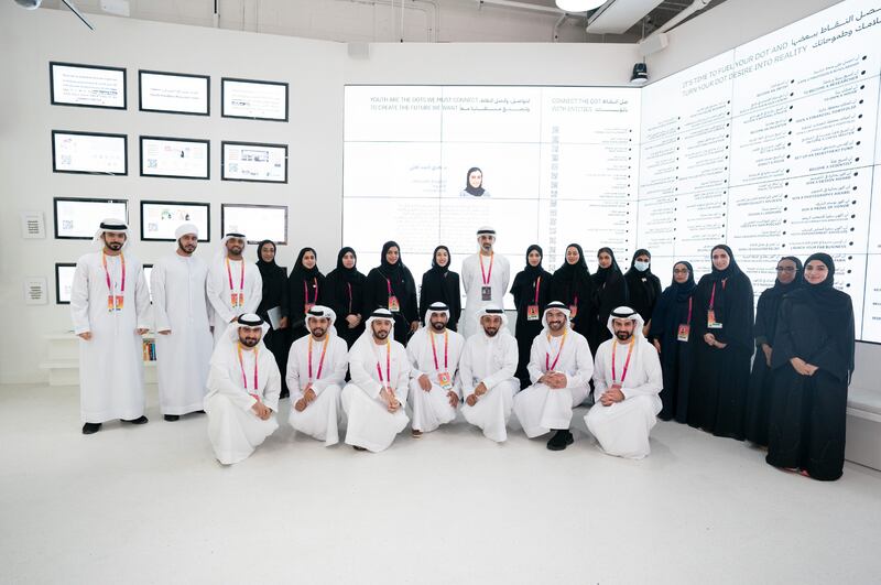 Sheikh Khaled with various officials and staff at the pavilion. Wam