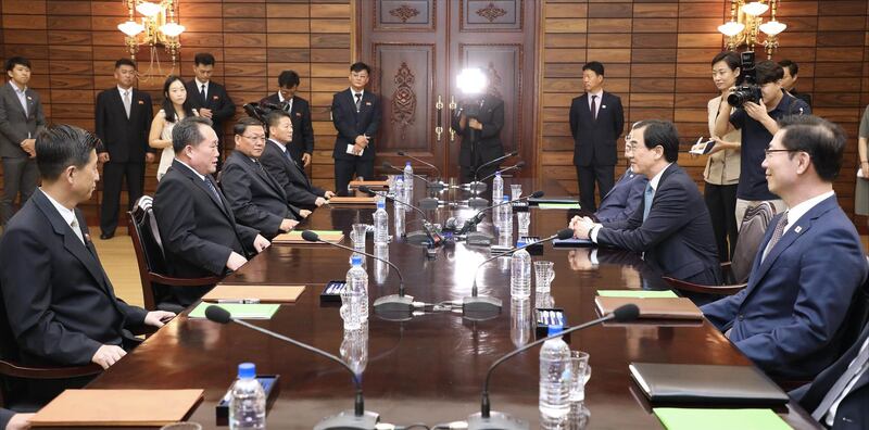 PANMUNJOM, NORTH KOREA - AUGUST 13:  In this handout photo provided by the Ministry of Unification, South Korean Unification Minister Cho Myoung-Gyon (R) talks with North Korean delegation head Ri Son-Gwon (L) during their meeting on August 13, 2018 in Panmunjom, North Korea. Senior officials from North and South Korea met at Panmunjom on Monday to discuss preparations for the possibility of a third summit meeting between North Korean leader, Kim Jong-un, and President Moon Jae-in of the South, in hopes of denuclearizing the Korean peninsula amidst easing tensions between both sides.  (Photo by South Korean Unification Ministry via Getty Images)