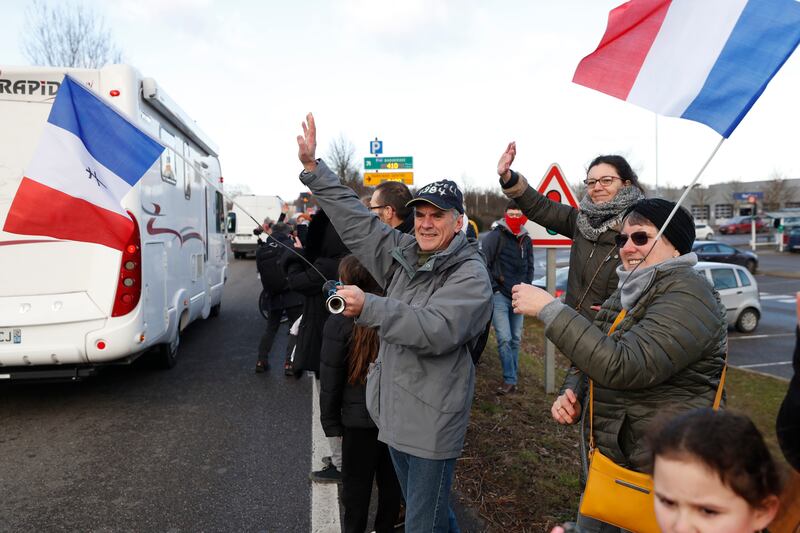 Well-wishers see off a convoy departing from Strasbourg. AP Photo